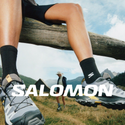 Salomon hiking shoes on mountain trail with scenic backdrop