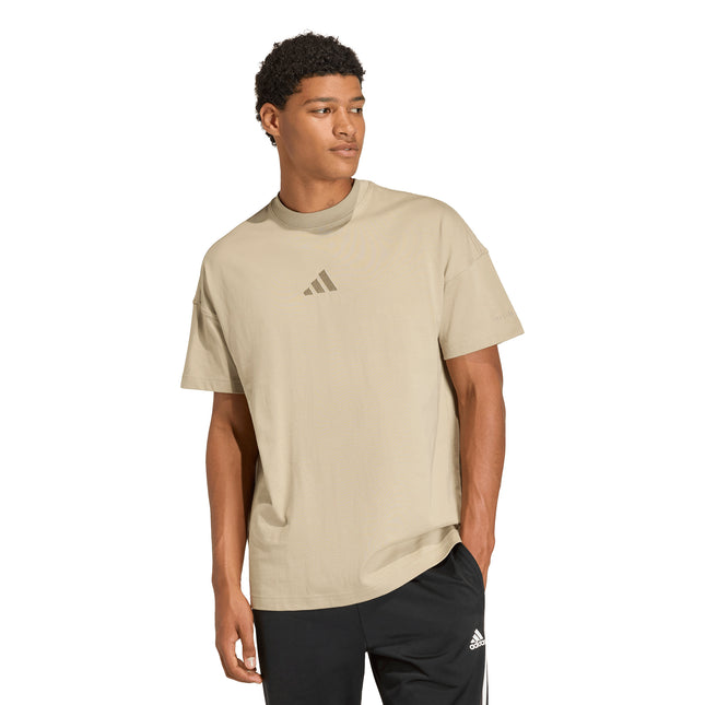 Polera Adidas A Szn T en color beige.