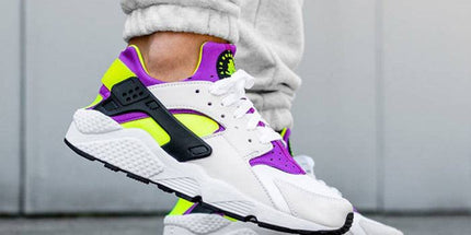 White sneaker with neon green and purple accents, stylish streetwear footwear