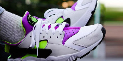 White sneakers with purple and neon green accents, stylish athletic shoes for casual wear